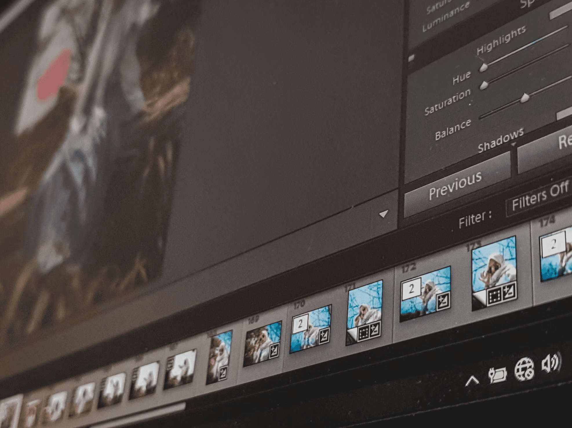 Close-up of photo editing software showing retouching and color grading controls
